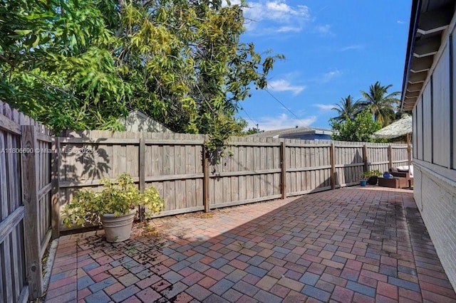 1222 S 14th Ct S, Lake Worth, FL 33460 - fenced backyard with a patio area