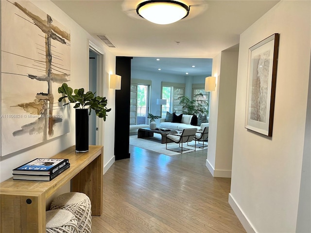 13637 Deering Bay Dr Unit 231, Coral Gables, FL 33158 - corridor with baseboards, light wood-style floors, and recessed lighting