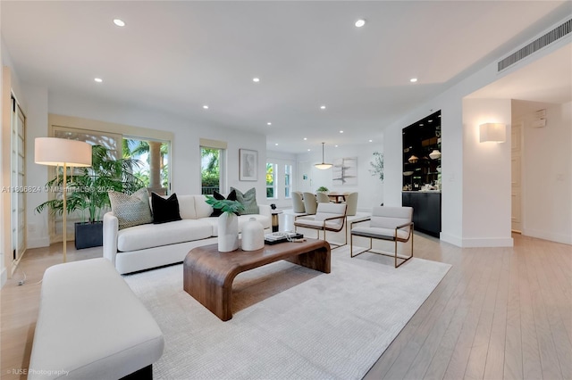 13637 Deering Bay Dr Unit 231, Coral Gables, FL 33158 - living room featuring recessed lighting, light wood-style flooring, baseboards, and bar area