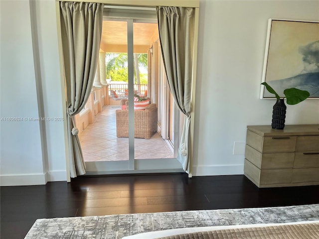 13637 Deering Bay Dr Unit 231, Coral Gables, FL 33158 - doorway to outside with baseboards and wood finished floors