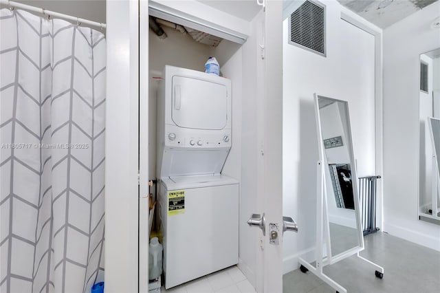 690 SW 1st Ct Unit 2109, Miami, FL 33130 - washroom featuring estacked washer and dryer and baseboards
