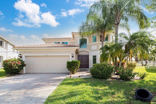 19311 SW 61st St, Pembroke Pines, FL 33332 - mediterranean / spanish-style home with stucco siding, a garage, decorative driveway, a tiled roof, and a front yard