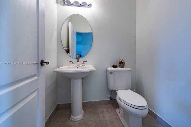19311 SW 61st St, Pembroke Pines, FL 33332 - half bath featuring toilet, tile patterned floors, baseboards, and a sink