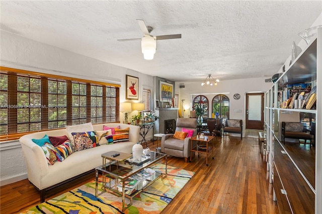 1510 Madrid St, Coral Gables, FL 33134 - living area featuring wood-type flooring, a textured ceiling, a ceiling fan, and baseboards