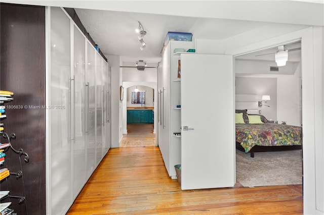 1510 Madrid St, Coral Gables, FL 33134 - hall featuring light wood-type flooring and arched walkways