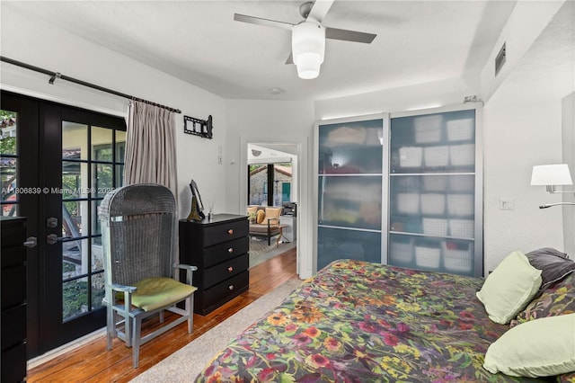 1510 Madrid St, Coral Gables, FL 33134 - bedroom featuring wood finished floors, french doors, and ceiling fan