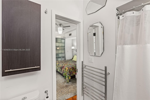 1510 Madrid St, Coral Gables, FL 33134 - bathroom featuring a ceiling fan, toilet, and a shower with shower curtain