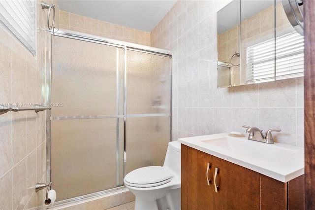 1693 NE 171st St, North Miami Beach, FL 33162 - full bath with tile walls, a shower stall, toilet, vanity, and tile patterned floors