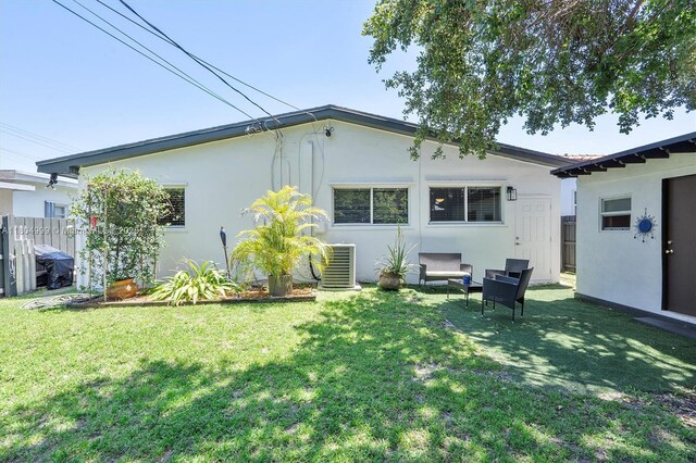 1693 NE 171st St, North Miami Beach, FL 33162 - back of property featuring stucco siding and central AC unit