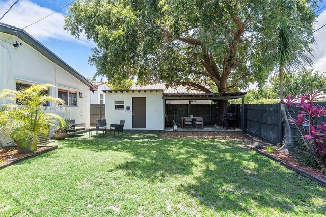 1693 NE 171st St, North Miami Beach, FL 33162 - view of yard featuring a patio