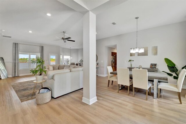2316 SW Santana Ave, Port St Lucie, FL 34953 - living room featuring baseboards, a chandelier, light wood-type flooring, a ceiling fan, and recessed lighting
