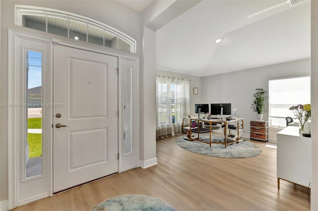 2316 SW Santana Ave, Port St Lucie, FL 34953 - foyer entrance with wood finished floors and baseboards
