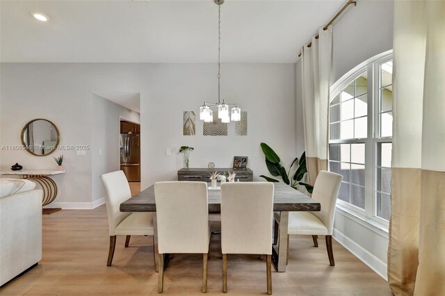 2316 SW Santana Ave, Port St Lucie, FL 34953 - dining room featuring a chandelier, baseboards, light wood-style flooring, and recessed lighting