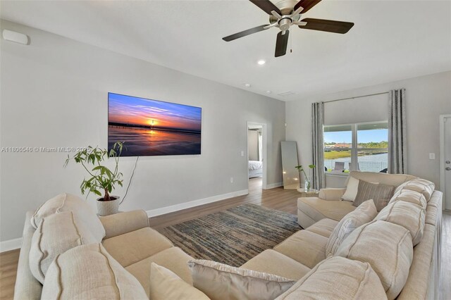 2316 SW Santana Ave, Port St Lucie, FL 34953 - living area featuring a ceiling fan, wood finished floors, baseboards, and recessed lighting
