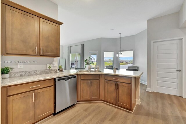 2316 SW Santana Ave, Port St Lucie, FL 34953 - kitchen with dishwasher, light wood-style floors, a peninsula, and brown cabinetry