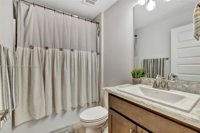 2316 SW Santana Ave, Port St Lucie, FL 34953 - full bath with toilet, vanity, and a shower with shower curtain