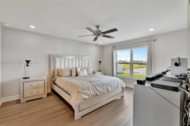 2316 SW Santana Ave, Port St Lucie, FL 34953 - bedroom featuring baseboards, light wood-type flooring, recessed lighting, and a ceiling fan