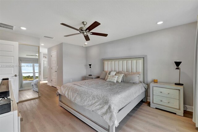 2316 SW Santana Ave, Port St Lucie, FL 34953 - bedroom with light wood finished floors, baseboards, recessed lighting, and a ceiling fan