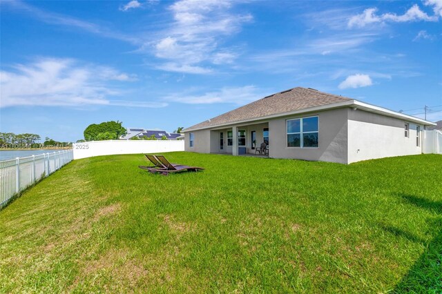 2316 SW Santana Ave, Port St Lucie, FL 34953 - rear view of property featuring stucco siding and roof with shingles