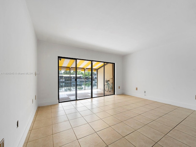16380 Briar Patch Pl, Miami Lakes, FL 33014 - empty room with light tile patterned flooring and baseboards