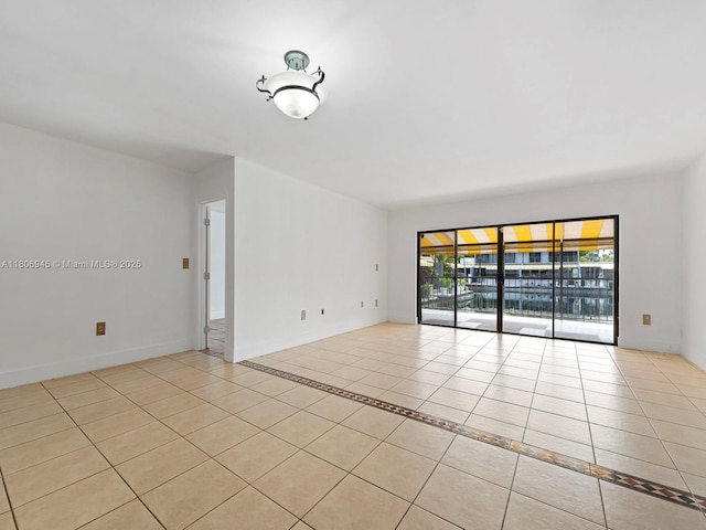 16380 Briar Patch Pl, Miami Lakes, FL 33014 - tiled empty room with baseboards