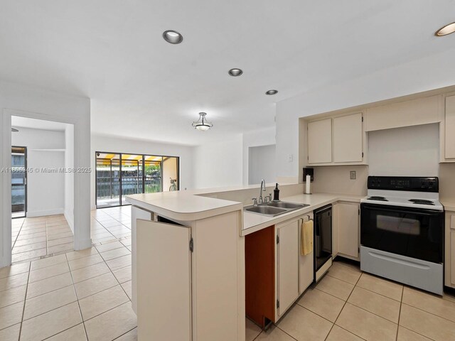 16380 Briar Patch Pl, Miami Lakes, FL 33014 - kitchen featuring range with electric cooktop, a sink, dishwasher, light countertops, and light tile patterned floors