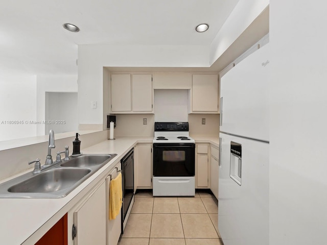 16380 Briar Patch Pl, Miami Lakes, FL 33014 - kitchen with range with electric cooktop, freestanding refrigerator, cream cabinets, light countertops, and recessed lighting