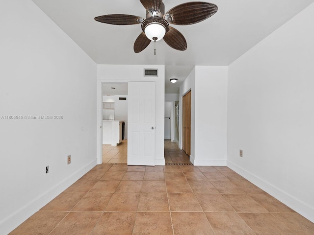 16380 Briar Patch Pl, Miami Lakes, FL 33014 - unfurnished bedroom featuring baseboards, light tile patterned floors, a ceiling fan, and a closet