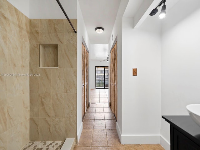 16380 Briar Patch Pl, Miami Lakes, FL 33014 - bathroom with vanity, a tile shower, and tile patterned flooring