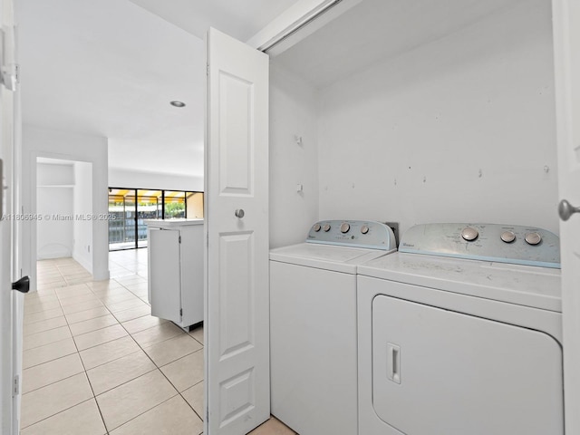16380 Briar Patch Pl, Miami Lakes, FL 33014 - washroom featuring washing machine and clothes dryer and light tile patterned flooring