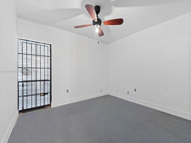 16380 Briar Patch Pl, Miami Lakes, FL 33014 - unfurnished room featuring concrete floors, a ceiling fan, and baseboards