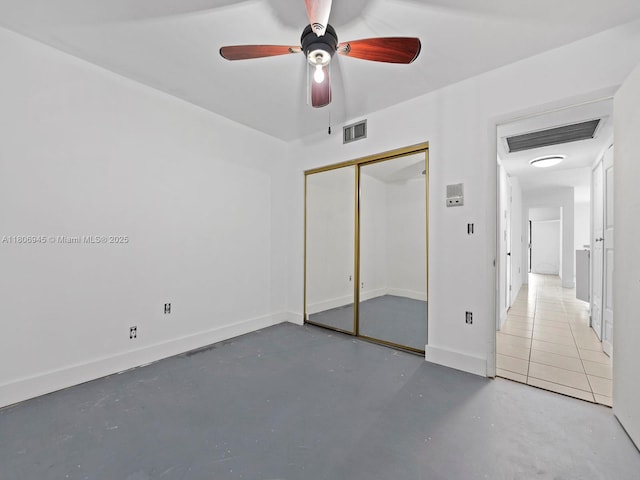 16380 Briar Patch Pl, Miami Lakes, FL 33014 - unfurnished bedroom with concrete flooring, a closet, a ceiling fan, and baseboards