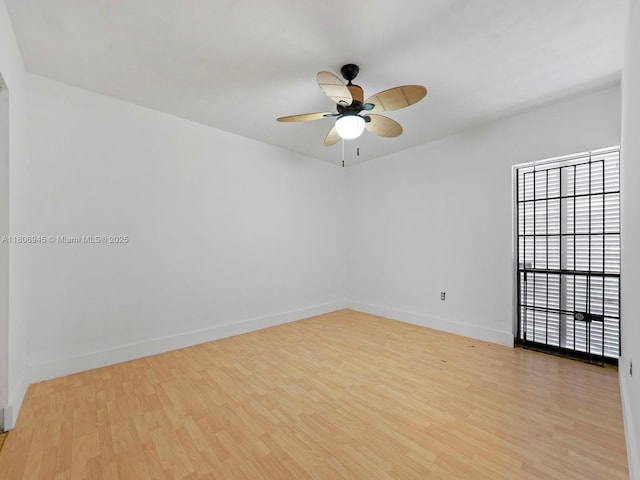 16380 Briar Patch Pl, Miami Lakes, FL 33014 - spare room with wood finished floors, ceiling fan, and baseboards