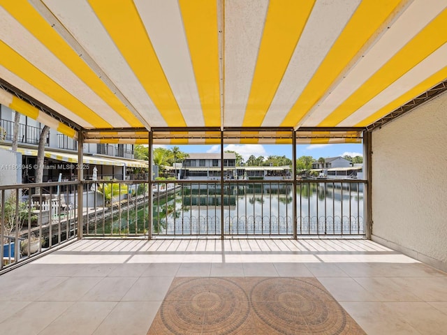 16380 Briar Patch Pl, Miami Lakes, FL 33014 - unfurnished sunroom featuring a water view and plenty of natural light
