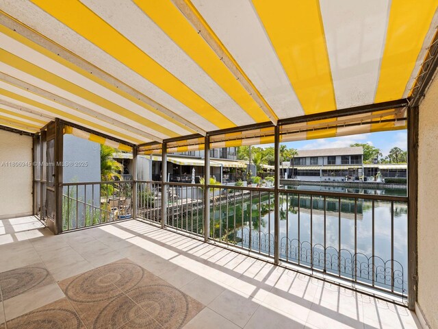 16380 Briar Patch Pl, Miami Lakes, FL 33014 - unfurnished sunroom featuring a water view