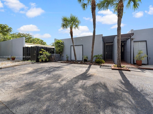 16380 Briar Patch Pl, Miami Lakes, FL 33014 - view of front of property featuring a gate and stucco siding