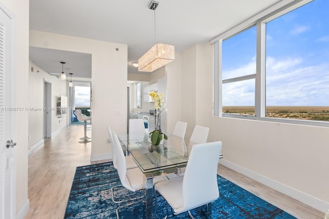 2641 N Flamingo Rd Unit 2408N, Sunrise, FL 33323 - dining area featuring wood finished floors and baseboards