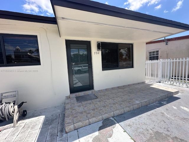 732 Burlington St, Opa-Locka, FL 33054 - entrance to property featuring stucco siding and a patio