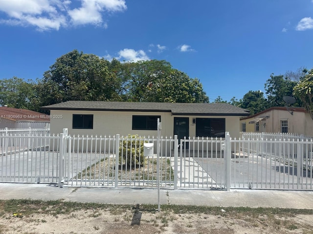 732 Burlington St, Opa-Locka, FL 33054 - ranch-style house featuring a fenced front yard and a shingled roof