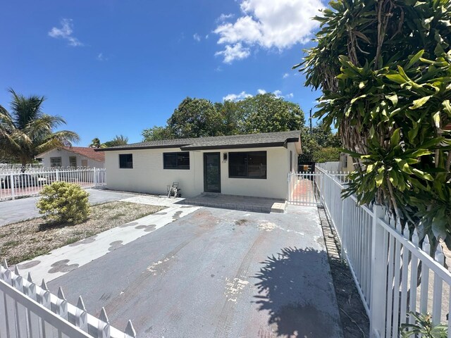 732 Burlington St, Opa-Locka, FL 33054 - view of front facade featuring stucco siding and a patio area