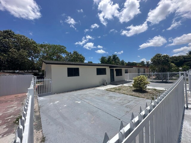 732 Burlington St, Opa-Locka, FL 33054 - back of property with a patio and stucco siding
