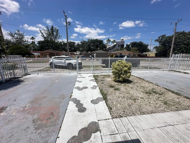 732 Burlington St, Opa-Locka, FL 33054 - fenced front yard with concrete driveway
