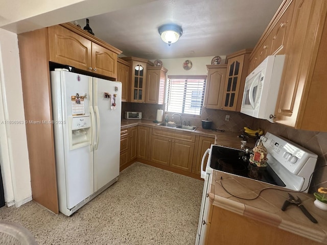 732 Burlington St, Opa-Locka, FL 33054 - kitchen with white appliances, a sink, glass insert cabinets, tasteful backsplash, and tile countertops