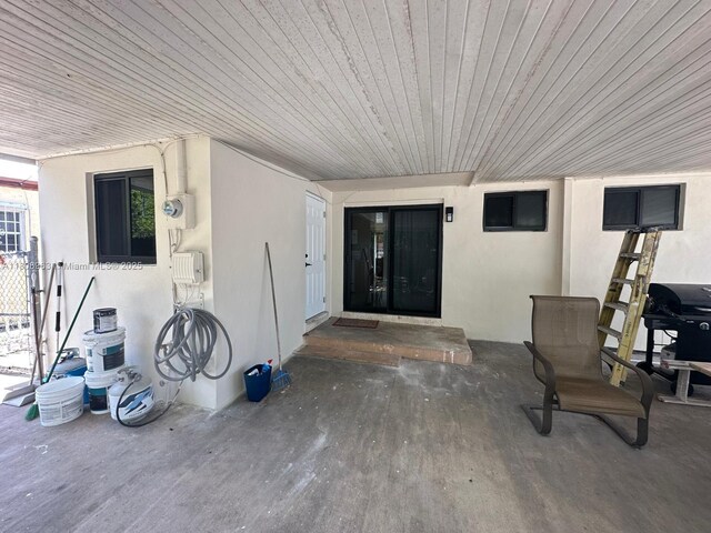732 Burlington St, Opa-Locka, FL 33054 - entrance to property with stucco siding and a patio area