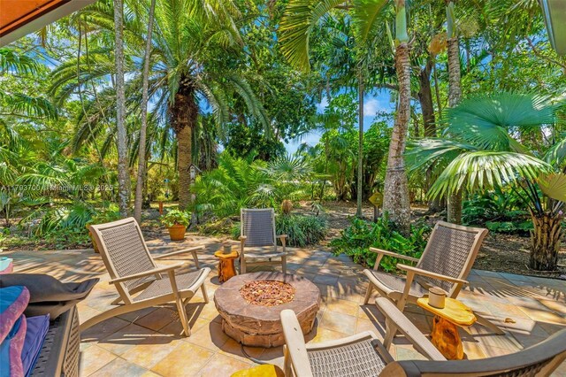 22800 SW 157th Ave, Miami, FL 33170 - view of patio / terrace with an outdoor fire pit