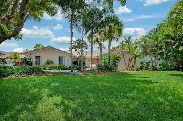 9620 E Calusa Club Dr, Miami, FL 33186 - view of front of property with stucco siding and a front yard