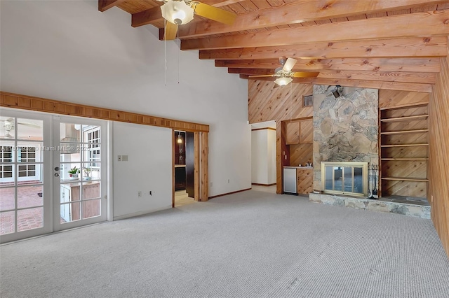 9620 E Calusa Club Dr, Miami, FL 33186 - unfurnished living room featuring a ceiling fan, carpet floors, a high ceiling, wooden ceiling with exposed beams, and french doors