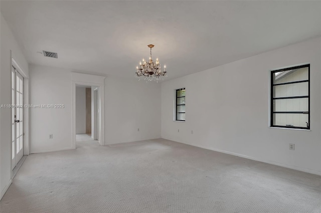 9620 E Calusa Club Dr, Miami, FL 33186 - unfurnished room featuring a chandelier, light colored carpet, and baseboards
