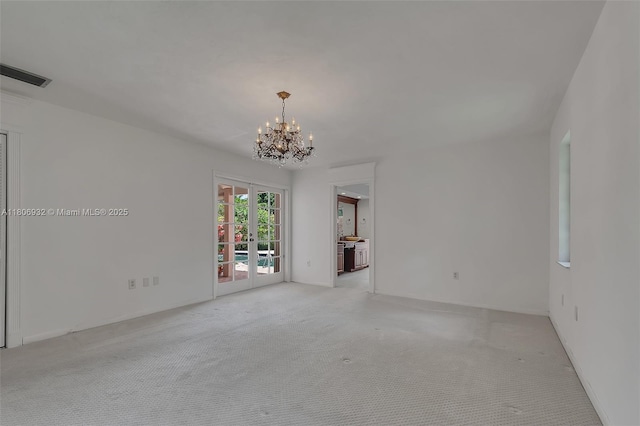 9620 E Calusa Club Dr, Miami, FL 33186 - carpeted empty room featuring french doors and a chandelier