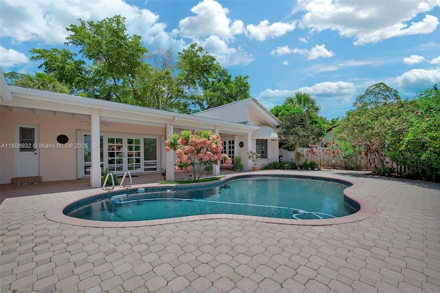 9620 E Calusa Club Dr, Miami, FL 33186 - view of pool featuring a patio area and french doors